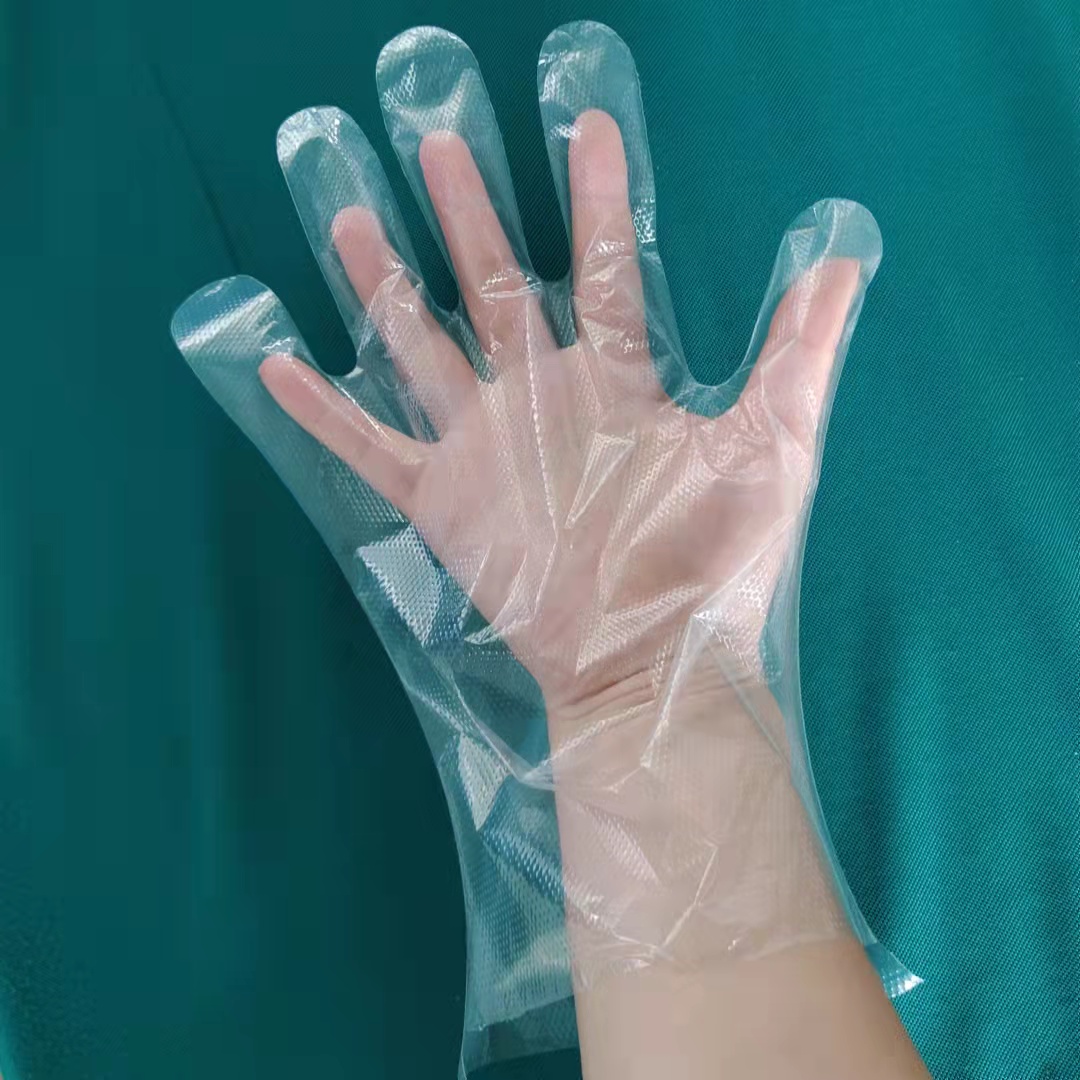 Luvas transparentes de plástico descartáveis ​​para uso médico e alimentar